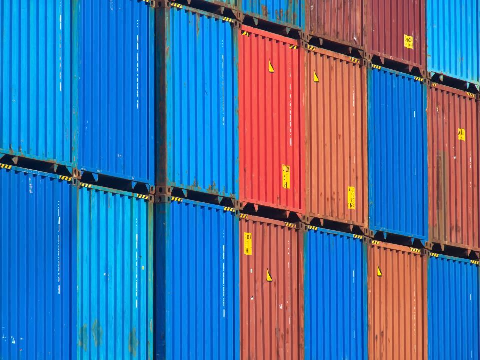 Shipping containers stacked in a container yard