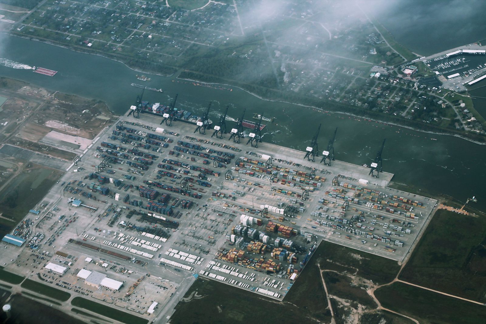 Aerial view of a container terminal stacked with shipping containers